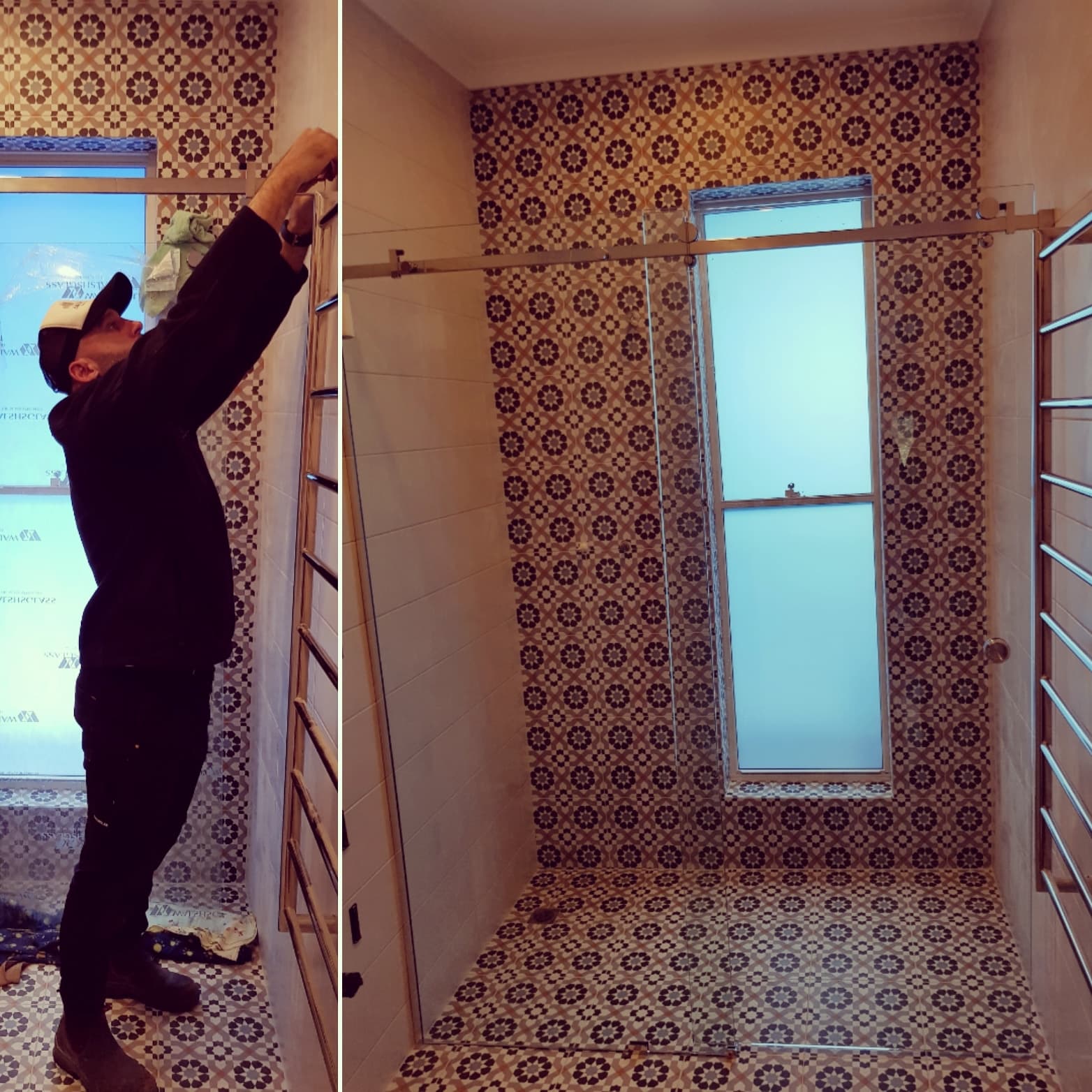 Man installing glass shower door in a bathroom featuring decorative patterned wall and floor tiles.
