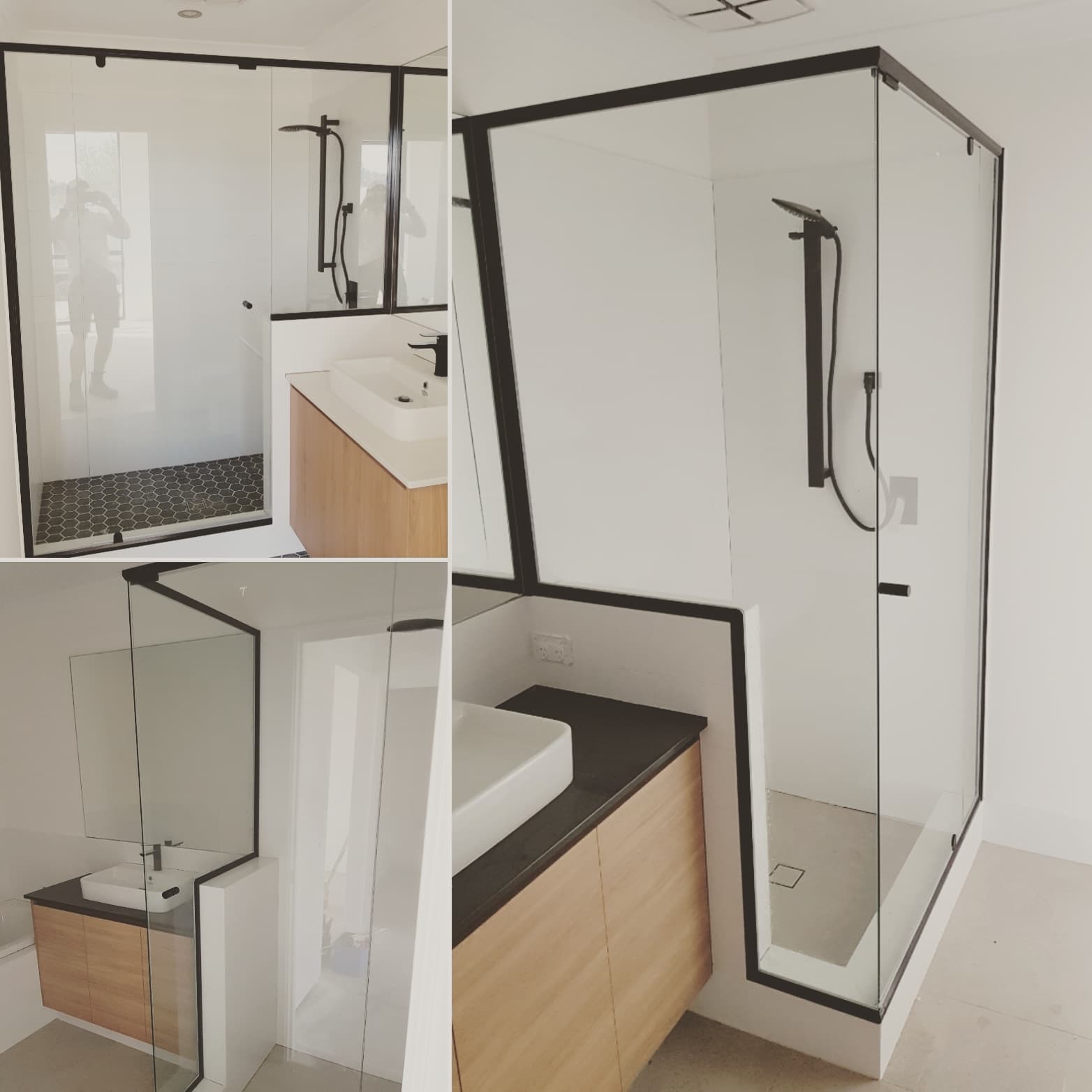 Modern bathroom featuring a black-framed glass shower, black hardware, and a light wood vanity.